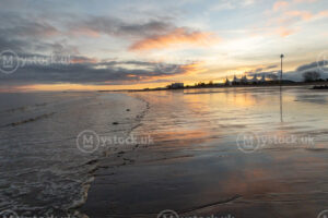 Sunrise Reflections on Minehead Beach